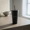 16oz Cold Cup in matte black stainless steel with a tapered design, lid, straw, and Created logo