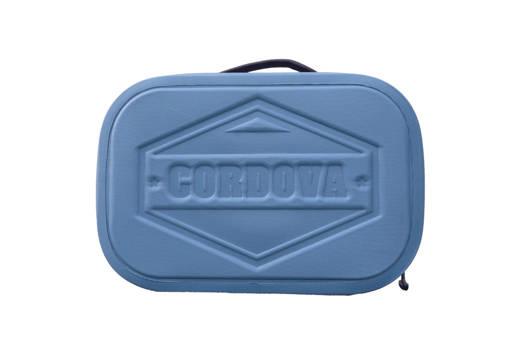 BACKCOUNTRY CLASS™ COOLER LUNCH BAG in blue, with a rigid textured shell, embossed Cordova logo, handle and zipper