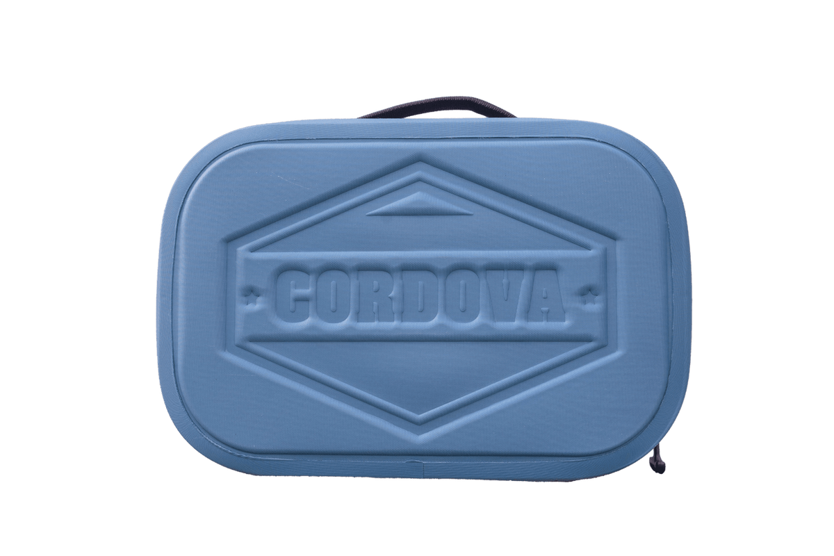 BACKCOUNTRY CLASS™ COOLER LUNCH BAG in blue, with a rigid textured shell, embossed Cordova logo, handle and zipper
