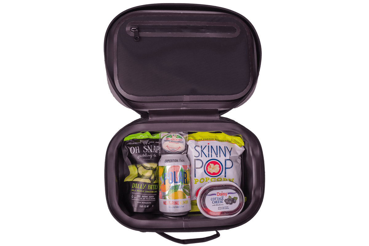 BACKCOUNTRY CLASS™ COOLER LUNCH BAG in dark plum ballistic nylon, open with a zippered lid and snacks inside