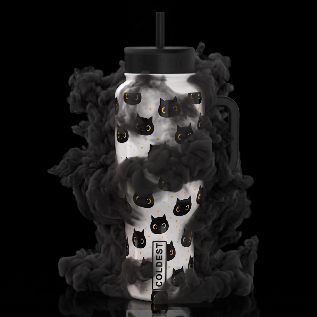 COLDEST 15oz Limitless Ultra tumbler with white cat and gold-dot pattern, black lid, straw, handle and label