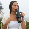 COLDEST 24oz Limitless bottle in black with colorful star patterns, a flip-top lid, and a sturdy side handle