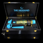 COLDEST Legacy 002 Mermaid water bottle in gold scale design with blue lids, displayed in a black presentation box