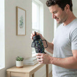 Man holding the Coldest Mini 6.7oz Insulated Water Bottle with a black swirl pattern and straw lid